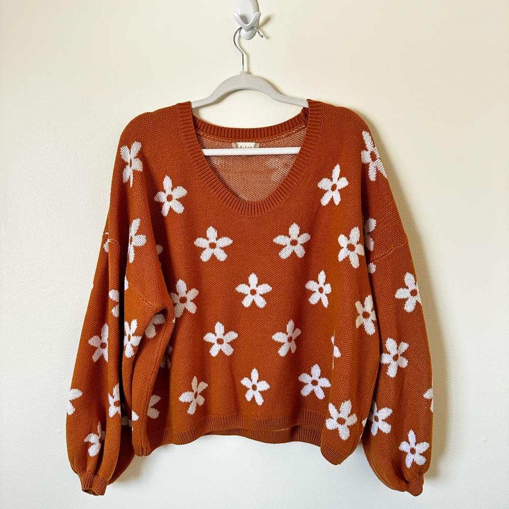 Knit floral sweater.
